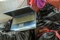 Old hardware put into container. Damaged Hardware Equipment In Dustbin.