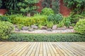 Wooden decking or flooring and plant in garden decorative