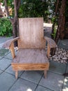 Old hardwood in garden chair with tree