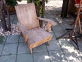 Old hardwood in garden chair with tree