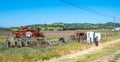 old harvester machine at a field out of order in rural landscape Royalty Free Stock Photo