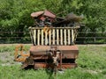 Old hay wagon with agricultural scrap metal Royalty Free Stock Photo