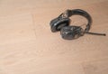 Old headphones dropped by trademan on new floor Royalty Free Stock Photo