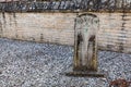 Old headstone on grave in abandoned cemetery. Royalty Free Stock Photo