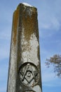 Old headstone with masonic carving