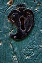 Old heart shaped door lock on a blue wooden door Royalty Free Stock Photo