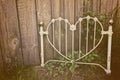 Old heart-shaped white wrought iron headboard