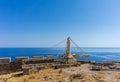 Old heavy crane on the top of Acropolis above ancient town Lindos on Rhodes island Royalty Free Stock Photo