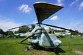 Old helicopter at the aircraft exhibition in the open space, helicopter blade in the foreground, military equipment exhibition,