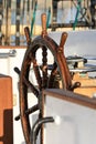Old helm on sailing ship in sunrise light Royalty Free Stock Photo