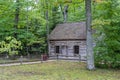 Old Hessler log cabin was built in the 1850s & sits near the Mission Point lighthouse on Lake Michigan near Traverse City, Michiga Royalty Free Stock Photo