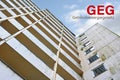 Old high-rise building and German Gebaeudeenergiegesetz (GEG), meaning Building Energy Law