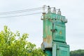 Old high voltage transformer and power line Royalty Free Stock Photo