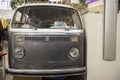 old hippie minibus, front of a stylish old camper, headlights, radiator grille