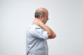 Old hispanic man with neck pain because of injury Royalty Free Stock Photo