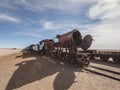 Old historic abandoned train engine locomotive ruins at Cementerio de Trenes cemetery graveyard, Salar de Uyuni Bolivia Royalty Free Stock Photo