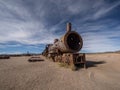 Old historic abandoned train engine locomotive ruins at Cementerio de Trenes cemetery graveyard, Salar de Uyuni Bolivia Royalty Free Stock Photo