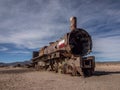 Old historic abandoned train engine locomotive ruins at Cementerio de Trenes cemetery graveyard, Salar de Uyuni Bolivia Royalty Free Stock Photo