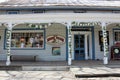 Bright sign and columns covered with vines welcoming visitors into the town, Rare Bear, Woodstock, New York, 2019