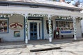 Bright sign and columns covered with vines welcoming visitors into the town, Rare Bear, Woodstock, New York, 2019