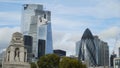 Old historic building on background of modern skyscrapers. Action. Contrast of architecture of buildings of different