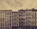 Old historic buildings in the SoHo neighborhood of New York City with faded sepia color effect Royalty Free Stock Photo