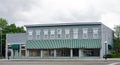 Old, Historic Business Building with Green Striped Awning