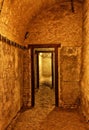 Old historic cellar with wooden framed door and dusty floor Royalty Free Stock Photo