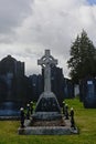 Old historic grave tomb with celtic cross in Glasnevin cemetery, Dublin.