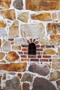 Old historic jail stone facade with bricks texture