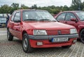 Old historic red famous French compact car Peugeot 205