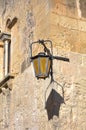 Old historic street lamp on the corner in the streets of the historic city of Mdina, the historic capital of Malta Royalty Free Stock Photo