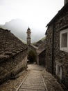 Old historic traditional schist stone rock building church tower in Sonogno village Verzasca Valley Ticino Switzerland Royalty Free Stock Photo