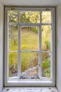 Old historic window with garden view