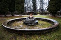 Old, historical, abandoned non - working fountain with fish sculptures, Baldone, Latvia