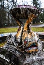 Old, historical, abandoned non - working fountain with fish sculptures, Baldone, Latvia