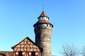 Old historical brick blocks tower with clear blue sky