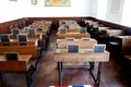 Old historical classroom with wooden desks and chalkboards