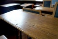 Old historical classroom with wooden desks and chalkboards