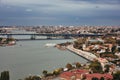 Old historical estuary bridge in Istanbul, lights of the city, old houses, highway and park Royalty Free Stock Photo