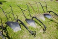 Old historical metal ploughs on gras Royalty Free Stock Photo