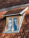 Old, historical red tiled roof and window, Kuldiga, Latvia Royalty Free Stock Photo