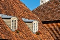 Old, historical red tiled roof and window, Kuldiga, Latvia Royalty Free Stock Photo