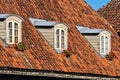 Old, historical red tiled roof and window, Kuldiga, Latvia Royalty Free Stock Photo