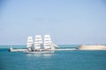 Old historical tall ship with white sails in blue sea russia Royalty Free Stock Photo