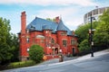 Old historical Victorian house with red brick walls in Montreal, Quebec, Canada