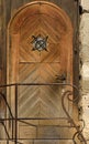 An old historical wooden door on an old wall in portrait format Royalty Free Stock Photo