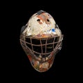 Old hockey helmet under the black background Royalty Free Stock Photo