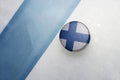 Old hockey puck with the national flag of finland. Royalty Free Stock Photo