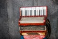 Old Hohner accordion left by street musician on stool